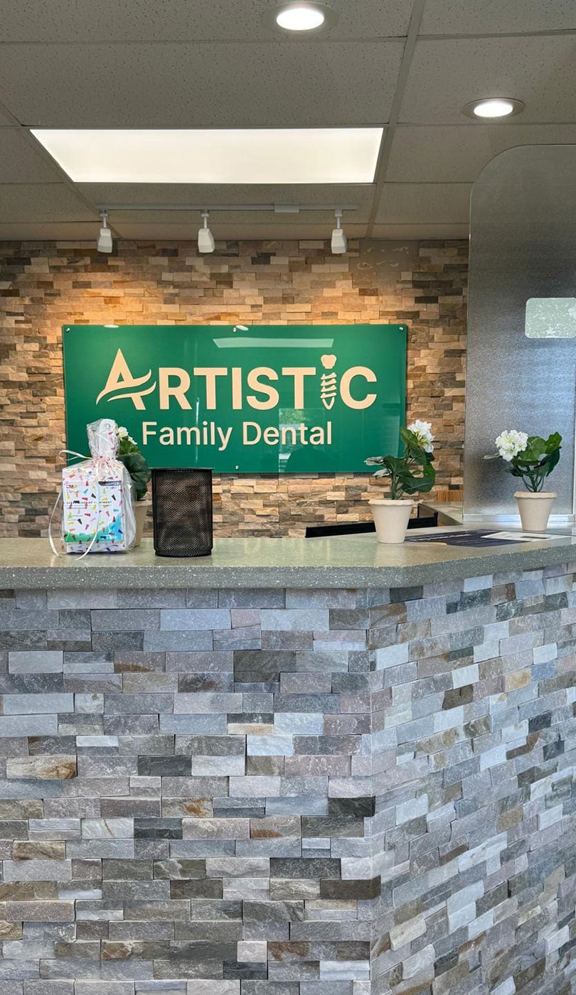 The image shows a modern dental or medical office interior with a dental chair, equipment, and a clean, professional environment.